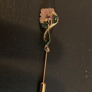 1928 stamped stickpin.